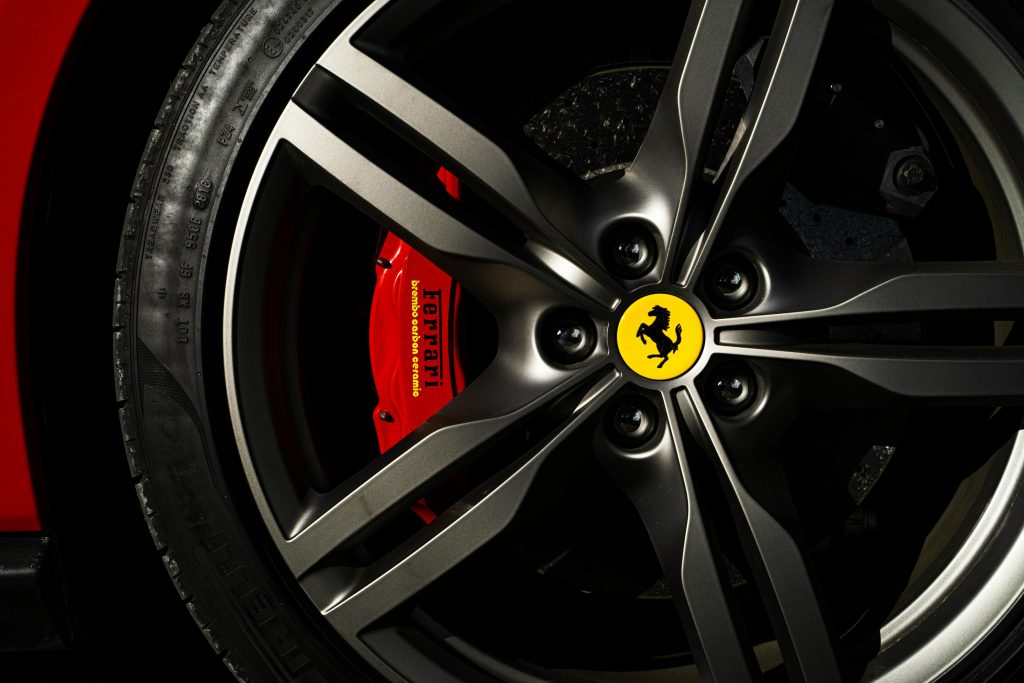 pexels photo 2922140 2922140 Detailed view of a Ferrari wheel and brake showcasing luxury automotive design.
