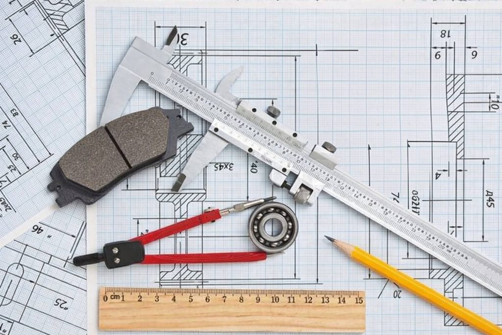 Our Products AUTOVA automotive engineering process showing brake pad design measurements and technical drawings used in developing durable automotive parts for harsh road conditions